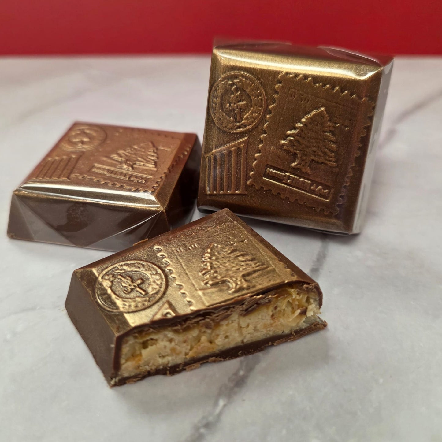 TAWDI Beirut milk chocolate bar with cashew baklava and orange blossom caramel filling, handmade in Anaheim