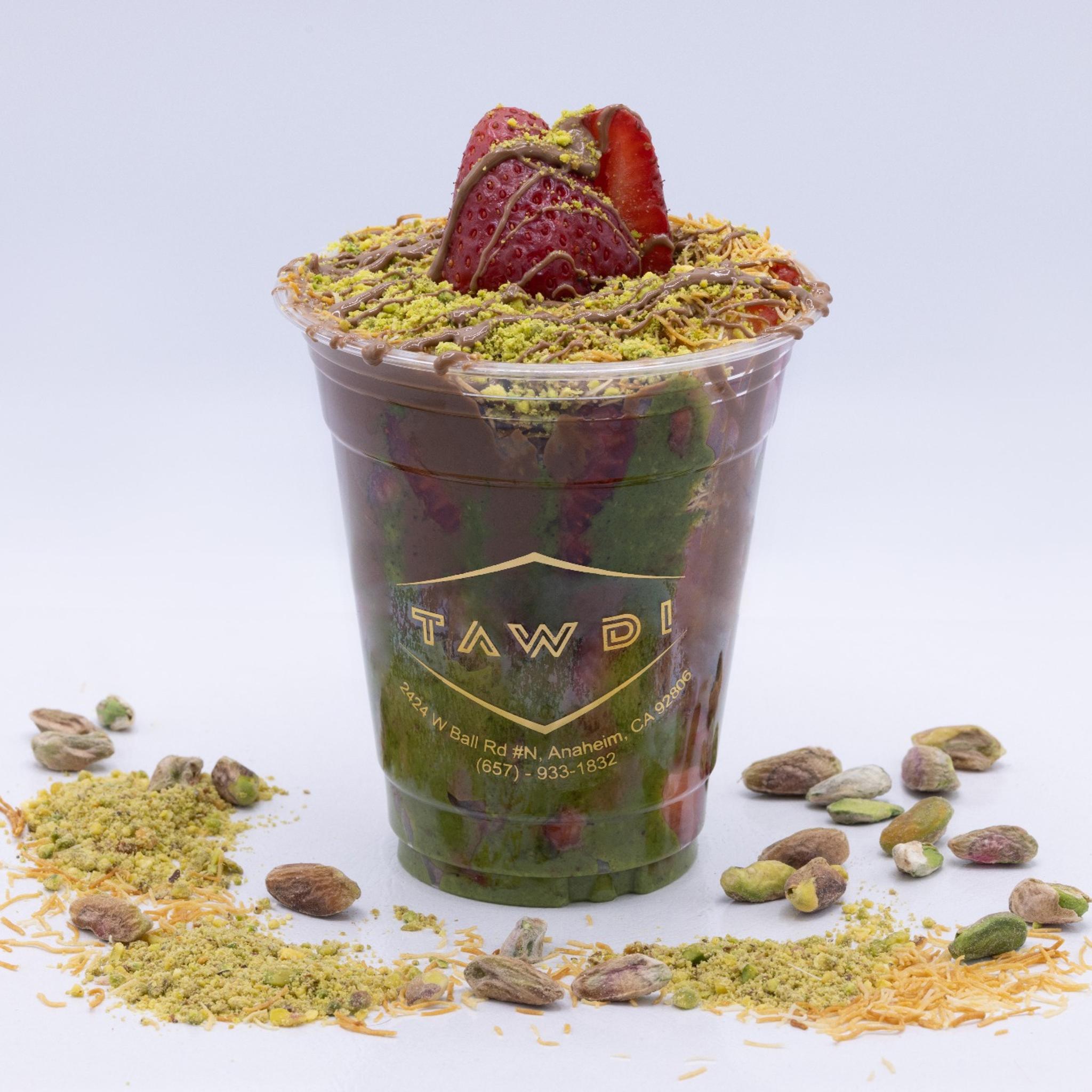 TAWDI creamy milk chocolate strawberry cup with pistachio paste and crispy golden kunafeh topping