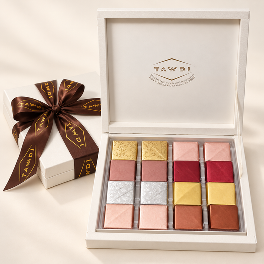 White TAWDI Signature Box open, showing 16 assorted handcrafted chocolates
